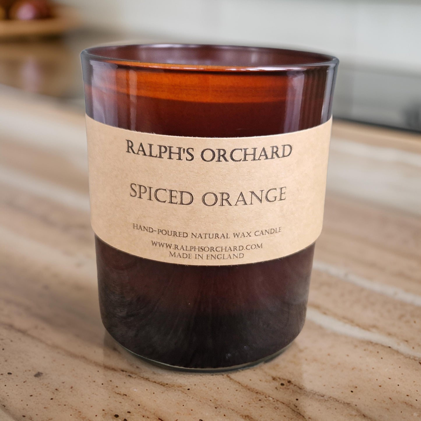 spiced orange candle in amber glass